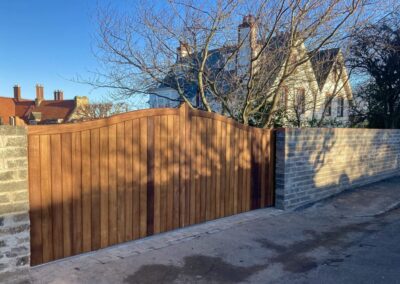 AES (SCOTLAND) LTD recently installed solid iroko tracked sliding gate in Gullane