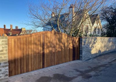 AES (SCOTLAND) LTD recently installed solid iroko tracked sliding gate in Gullane