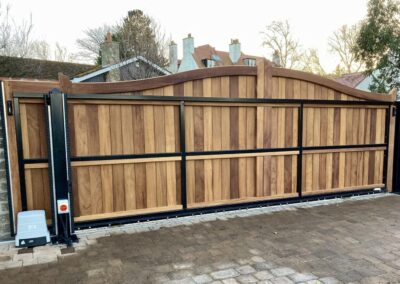 AES (SCOTLAND) LTD recently installed solid iroko tracked sliding gate in Gullane
