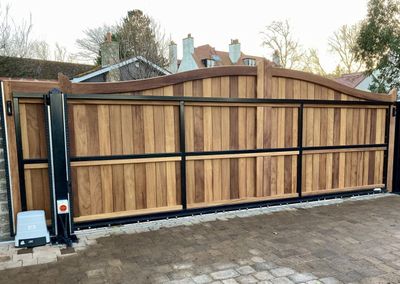AES (SCOTLAND) LTD recently installed solid iroko tracked sliding gate in Gullane