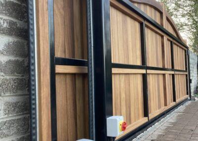 AES (SCOTLAND) LTD recently installed solid iroko tracked sliding gate in Gullane