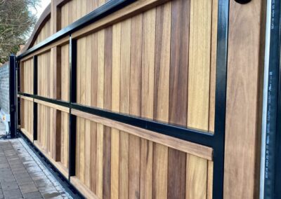 AES (SCOTLAND) LTD recently installed solid iroko tracked sliding gate in Gullane