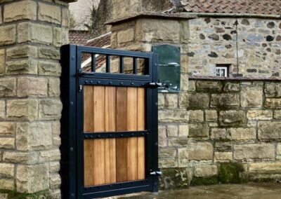 AES (SCOTLAND) LTD installed metal frame wooden infill pedestrian gate Edinburgh