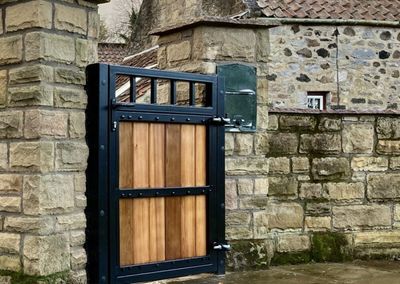 AES (SCOTLAND) LTD installed metal frame wooden infill pedestrian gate Edinburgh