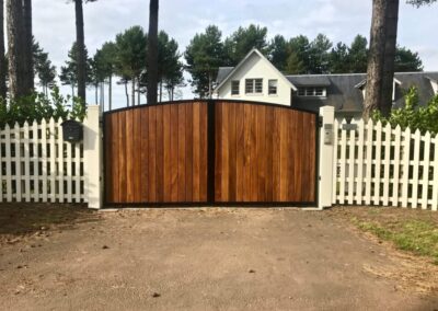 AES (SCOTLAND) LTD new automatic metal framed Iroko clad driveway gates, installed in King's Cairn at Archerfield.