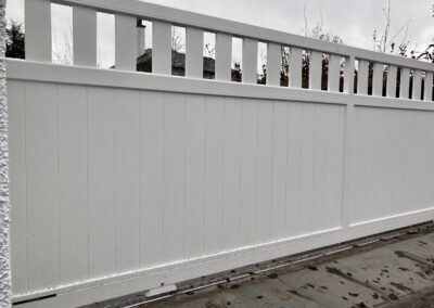 AES (SCOTLAND) LTD newly installed aluminium automatic sliding driveway gate with matching pedestrian gate in RAL9010.