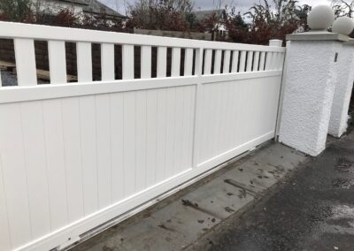 AES (SCOTLAND) LTD newly installed aluminium automatic sliding driveway gate with matching pedestrian gate in RAL9010.