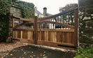 AES (SCOTLAND) LTD recently installed manual Iroko driveway gates with metal inserts. ‍‍‍‍