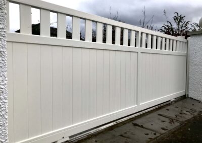 AES (SCOTLAND) LTD newly installed aluminium automatic sliding driveway gate with matching pedestrian gate in RAL9010.