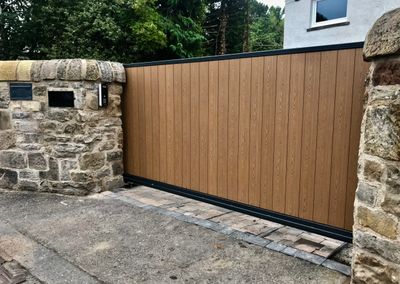 Automatic metal frame composite infill cantilever sliding gate installed in Edinburgh