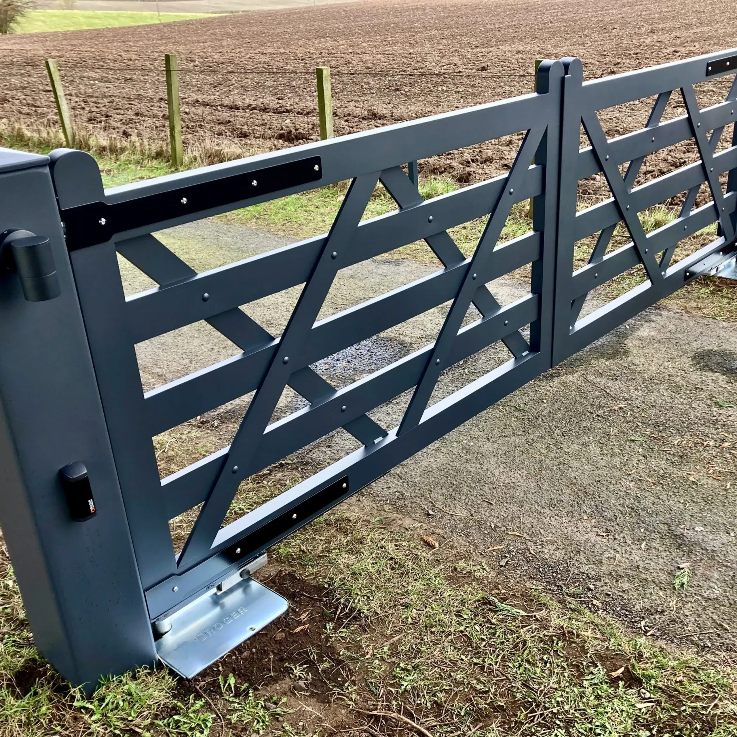 Grey full aluminium electric field gates with underground operators in Fife 