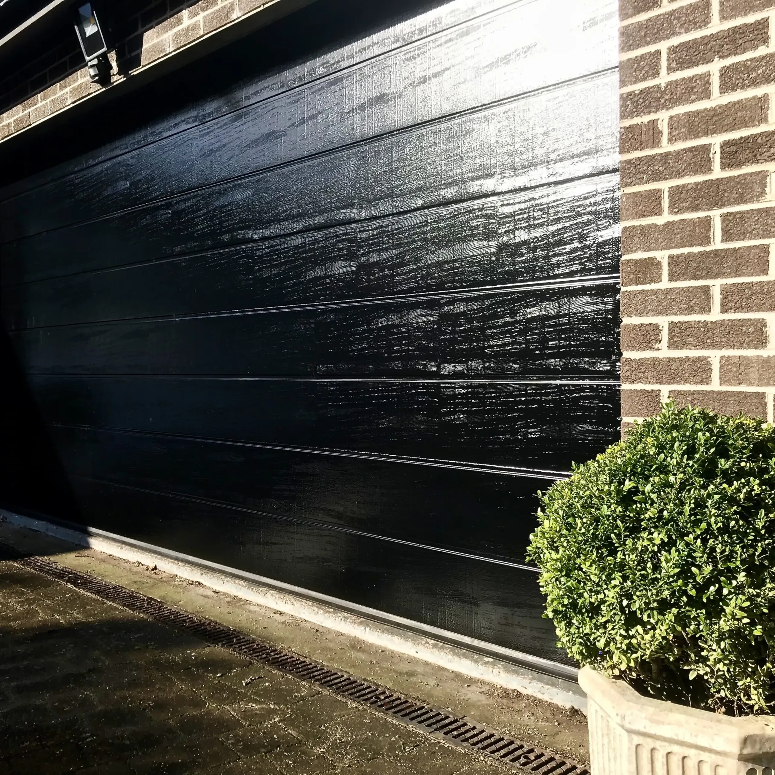 Black double sectional garage door installed in Edinburgh 