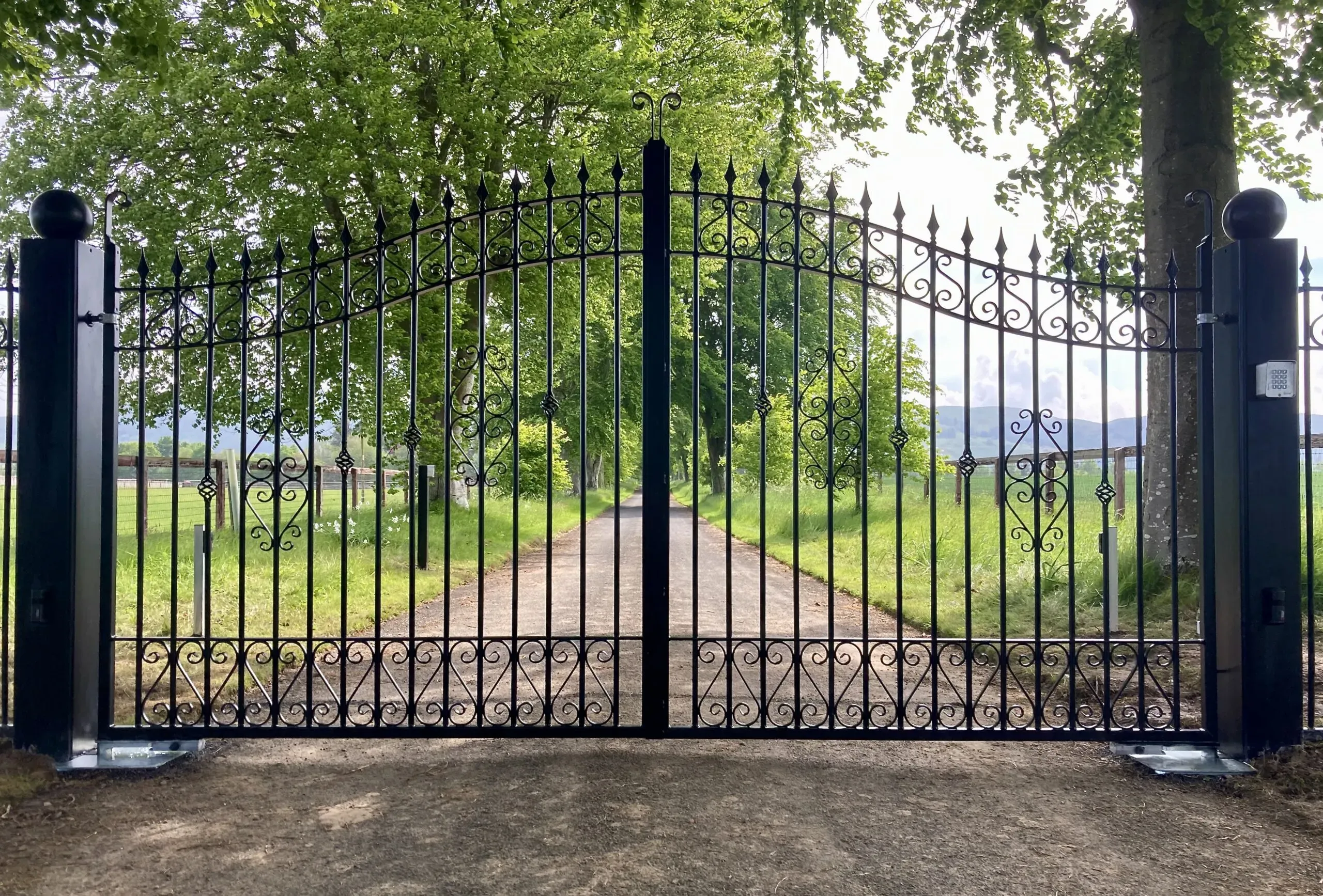 Decorative wrought iron gates with underground operators installed at a property in Perth