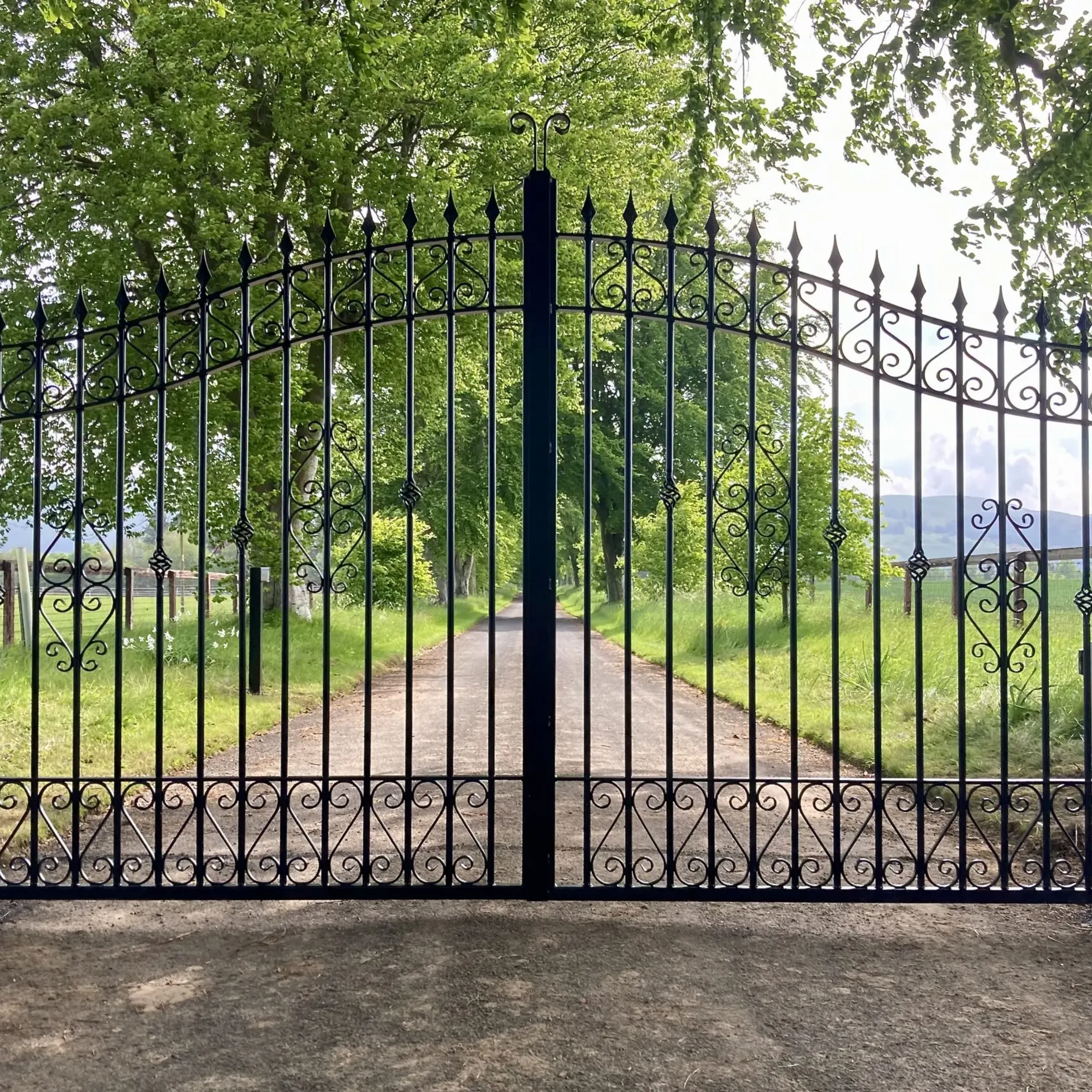 Decorative wrought iron gates with underground operators installed at a property in Perth