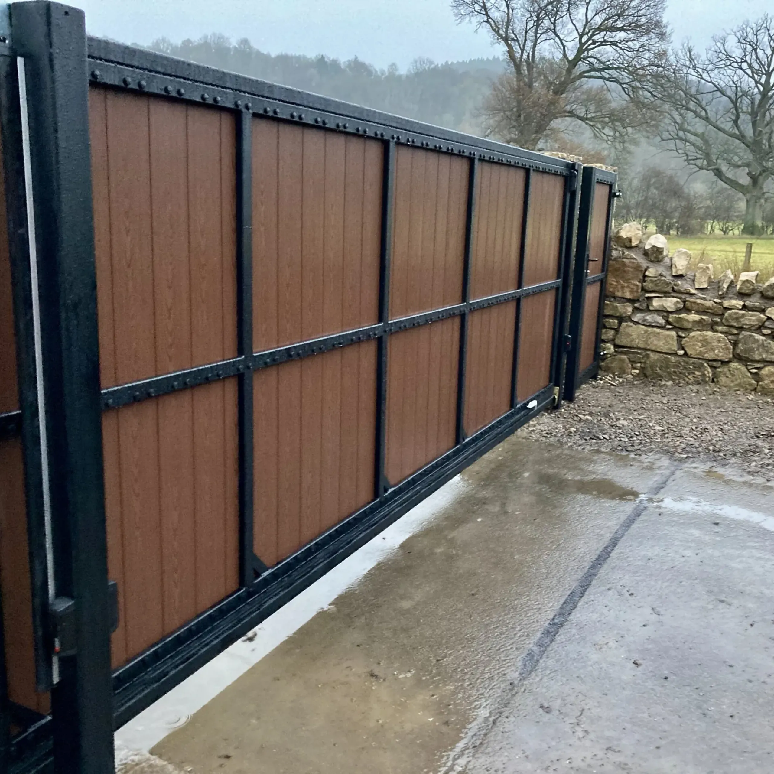 Automatic composite cantilever sliding gate with matching pedestrian gate installed in Bridge of Allan 
