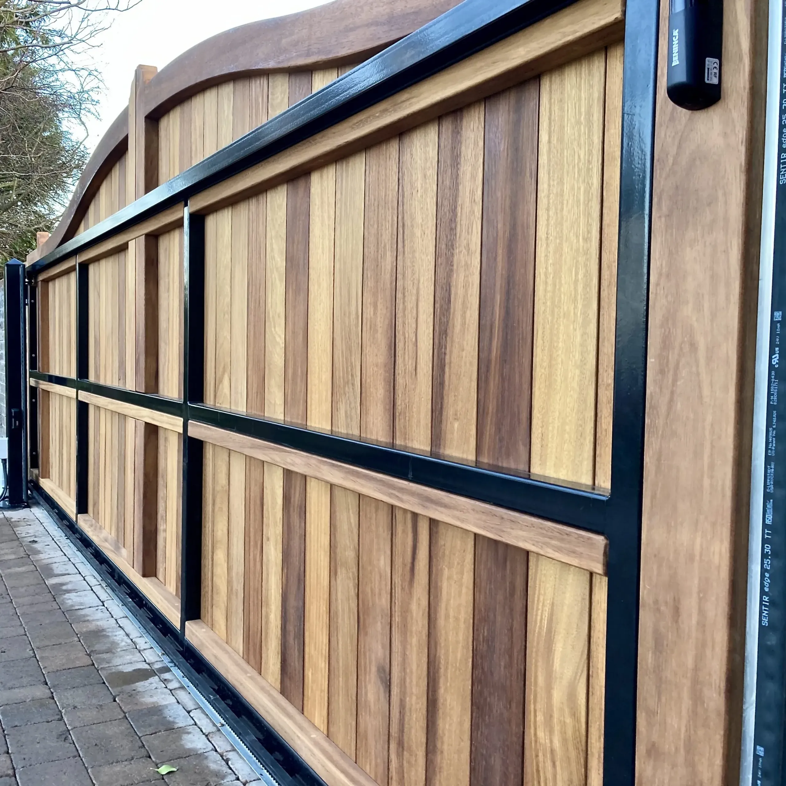 Solid Iroko hardwood electric sliding gate installed at a residential property in Scotland 