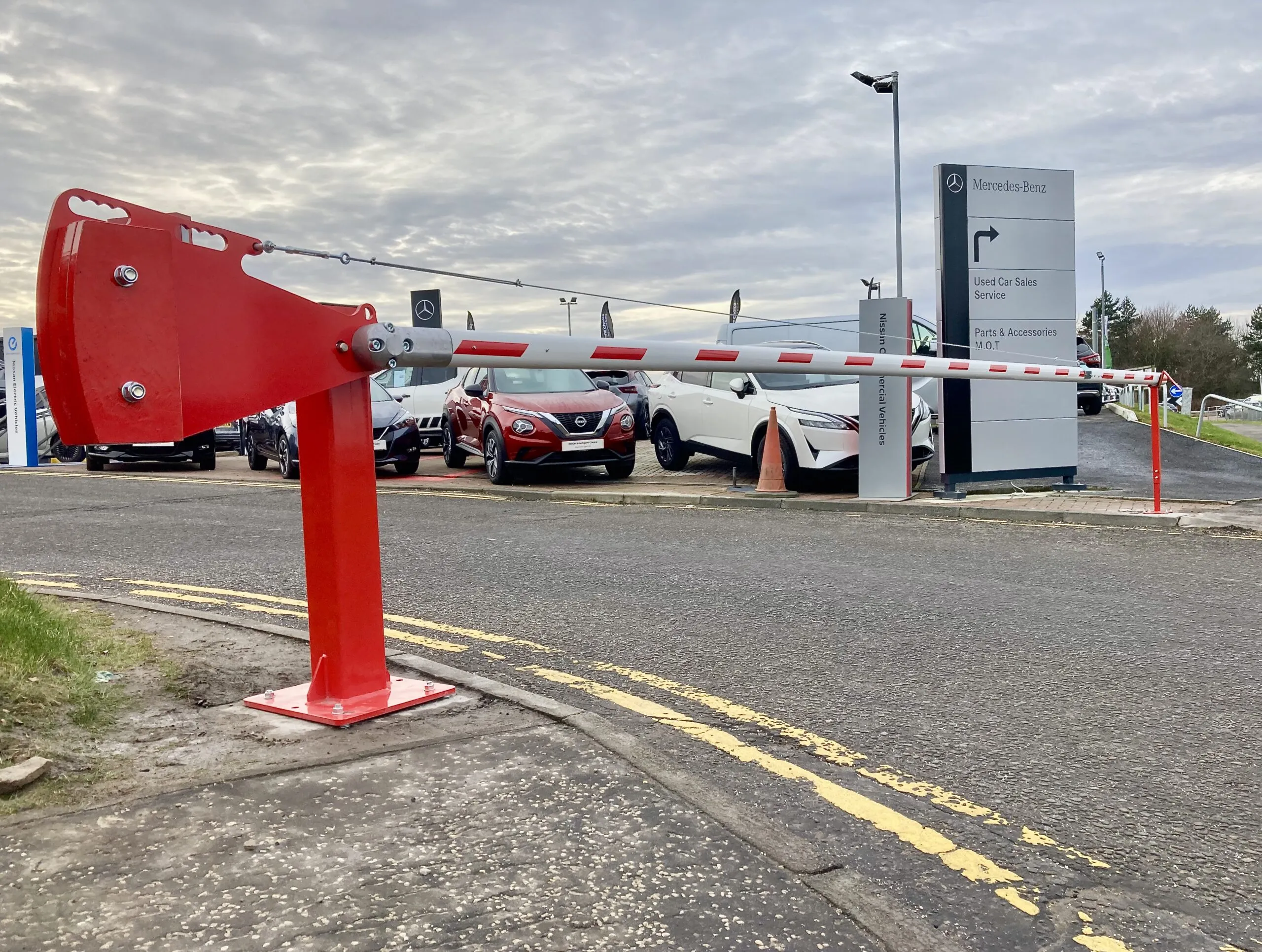 Manual rising barrier securing vehicle access at an industrial site in Fife 