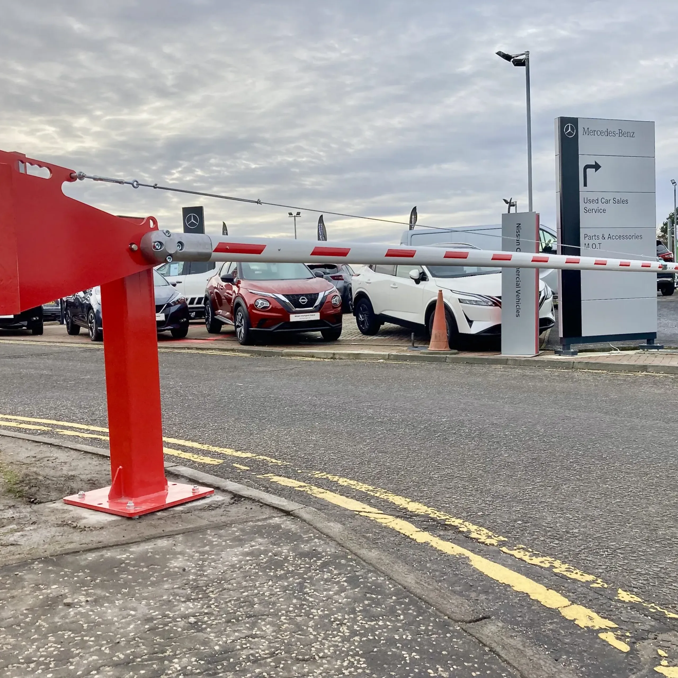 Manual rising barrier securing vehicle access at an industrial site in Fife 