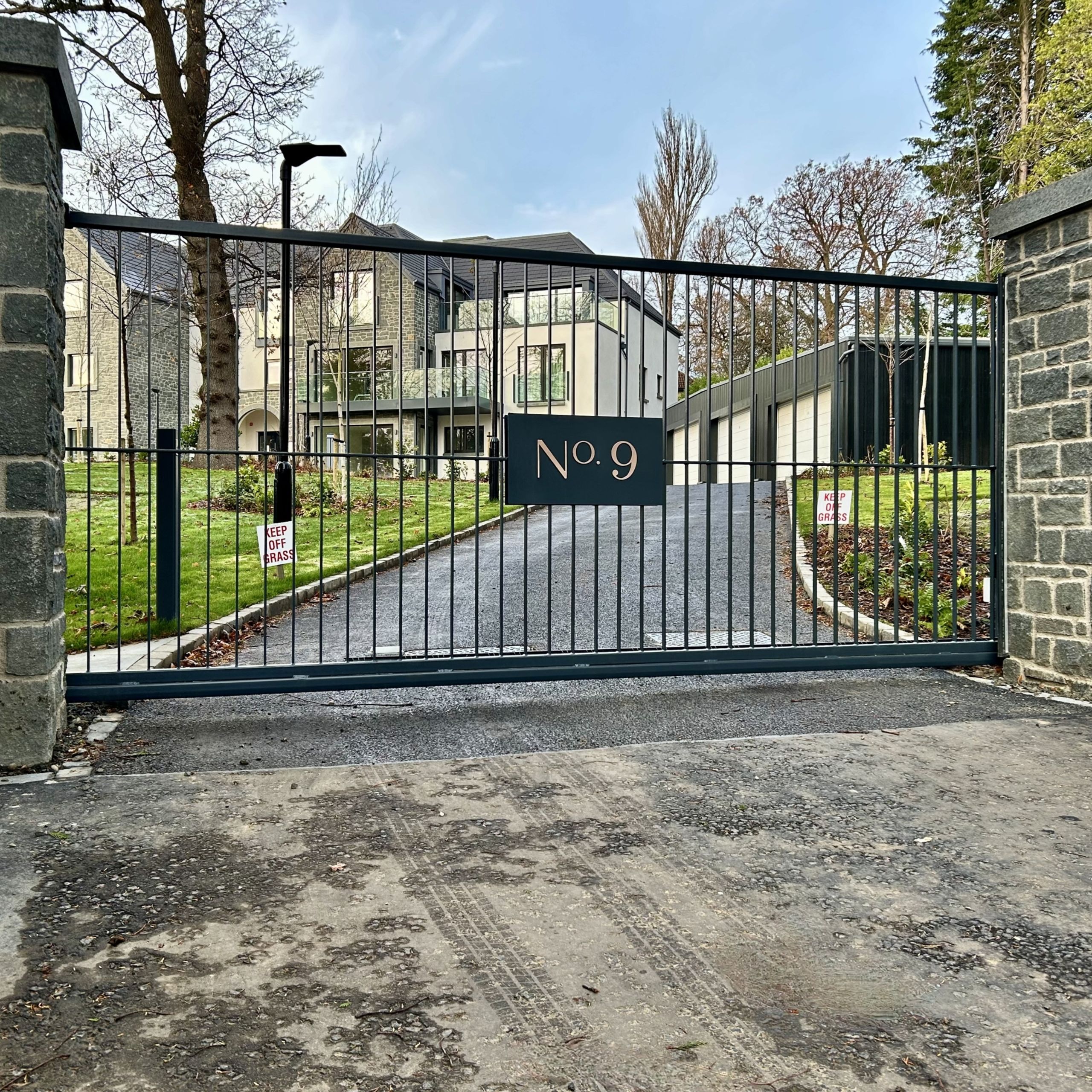 Electric metal sliding gate with matching pedestrian gate installed in Barnton, Edinburgh